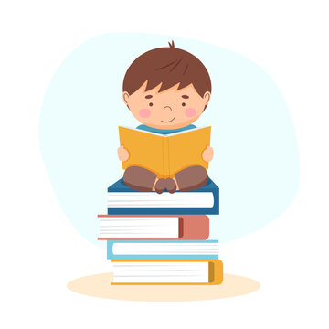 The boy reading a book - back to school and education concept	