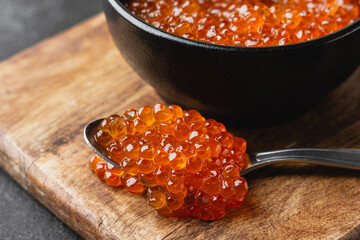 Red salmon caviar on a spoon