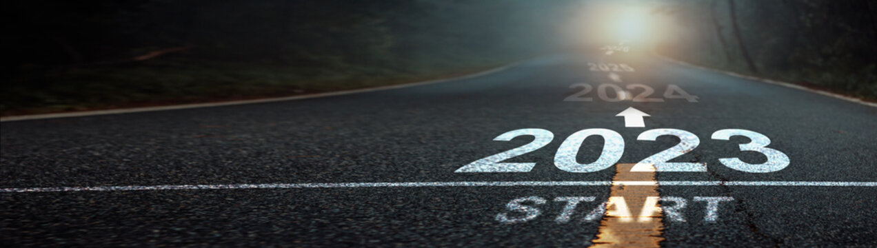 Direction to new year concept and sustainable development idea. Number of 2023 to 2027 on asphalt road surface with marking lines