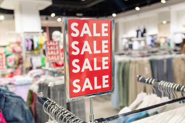 sign with the word sale in a clothing store