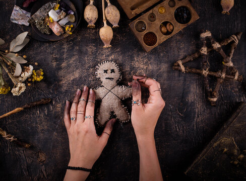 Voodoo doll. Black magic esoteric ritual. Halloween concept.