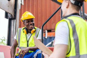 African American and Caucasian man worker work in container terminal