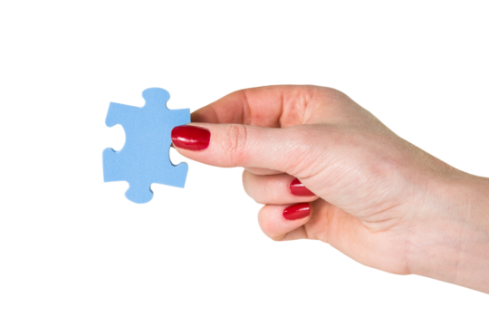 Female hand holding the missing piece of jigsaw puzzle - Powered by Adobe