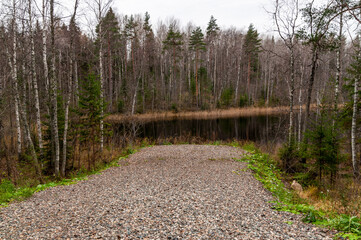 gravel-covered area for the entrance of fire vehicle to the shore of the lake. fire pier