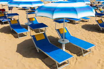 Traditional beach chair and umbrella. Rimini, Italy,
