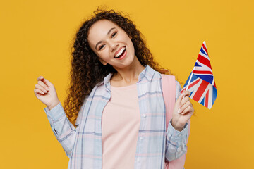 Young black teen girl student she wear casual clothes backpack bag hold british flag point index...