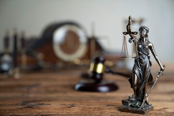 Law concept. Law symbols composition: judge’s gavel, Themis sculpture and scale on rustic wooden...
