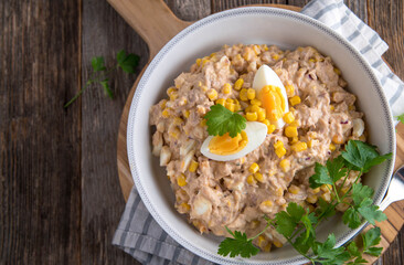 Tuna salad with mayonnaise, boiled eggs, onions and corn