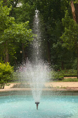 Fountain in the city park on a sunny summer day.