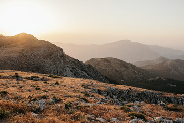 Misty mountain ridges in sunny day