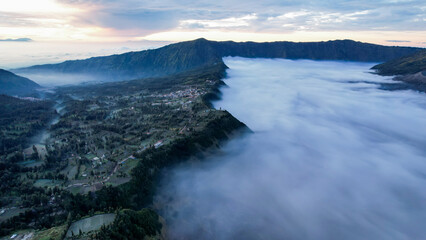 Fototapeta na wymiar Aerial view of the Mount Bromo, is an active volcano and part of the Tengger massif, in East Java, Indonesia. East Java, Indonesia, August 24, 2022