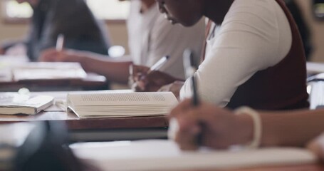 Writing, education and study in classroom of students working in their notebook at their desk for quiz test. High school children learning and reading at desk for exam mindset preparation - Powered by Adobe