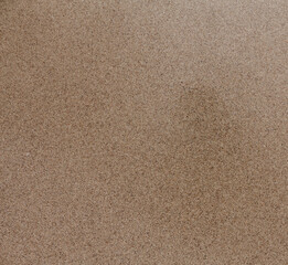 Natural smooth sand texture. Sandy beach surface, top view. Sand background.