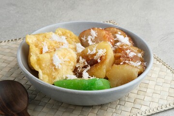 Indonesian sweet snack called gethuk. Made from mashed cassava, and sprinkled with grated coconut, it tastes sweet and delicious. 