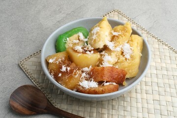 Indonesian sweet snack called gethuk. Made from mashed cassava, and sprinkled with grated coconut, it tastes sweet and delicious. 
