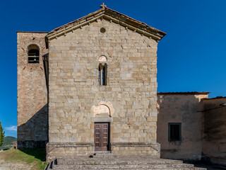 The facade of the ancient parish church of San Giovanni Evangelista in Montecuccoli in Valdibure,...