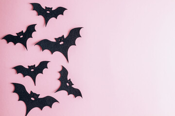 Halloween decorations on pastel pink background. Halloween concept. Flat lay, top view, copy space