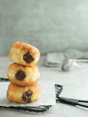 Bomboloni Donut with chocolate fillings. Blurred background and selected focus.
