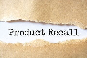Text Product Recall appearing behind ripped brown paper.