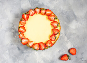 Sweet breakfast, delicious cheesecake with fresh strawberries, homemade recipe on concrete table.