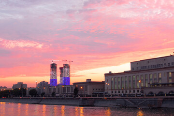 MOSCOW, RUSSIA- AUGUST 14, 2022 : view from Savvinskaya embankment to a residential building on...