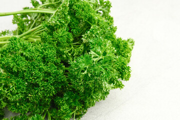 Fresh organic parsley herb isolated on white background. Close up