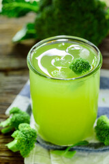 Glass of broccoli juice, broccoli Healthy drink on wood back ground, Green vegetable smoothie