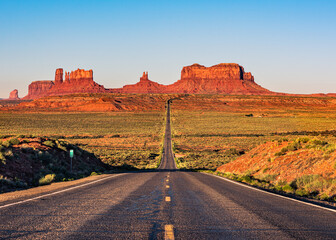 Classic sunrise view of Highway 163 at milepost 131 to Monument Valley, USA