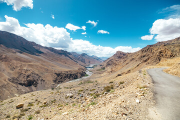 paved road at high altitude in the dry desolate mountains of Spiti Valley near Kaza India