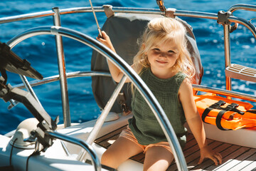 Child girl traveling on yacht family active vacations cruise blue sea view summer holidays
