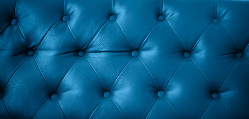 Close up texture of dark blue leather sofa retro style can be use as background 