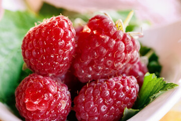 Ripe raspberries close-up. Grocery background of raspberries in close-up