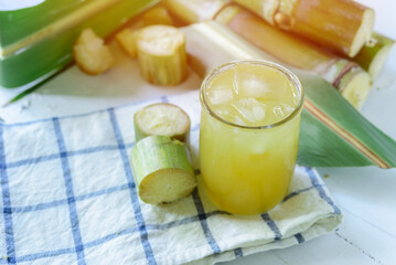 Fresh squeezed sugar cane juice, Sugar cane juice, Sugar cane drink with ice.