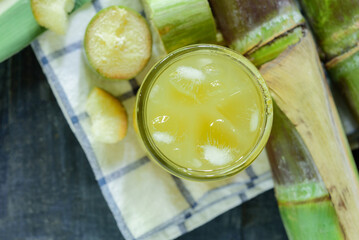 Fresh squeezed sugar cane juice, Sugar cane juice, Sugar cane drink with ice.
