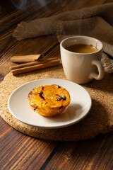 Typical Portuguese dessert pastel de chila - pastry tart of squash with a cup of hot coffee. traditional portuguese sweets