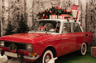 red car with gifts on the roof for christmas and new year, santa claus car, christmas car travel,...