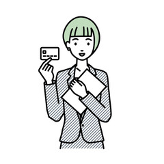 Fototapeta na wymiar 立って書類とカードを手に持つビジネススーツの女性