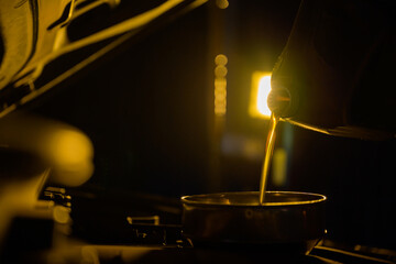 refuel or pour oil into engine gear motor maintenance gear energy fuel concept