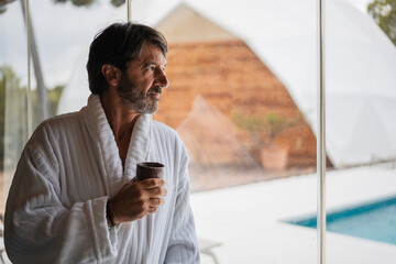 Focused aged man having rest in nature