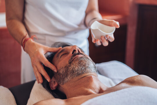 Adult man enjoying head massage