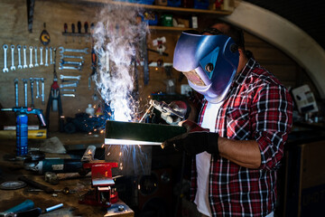 Workman heating detail with gas torch