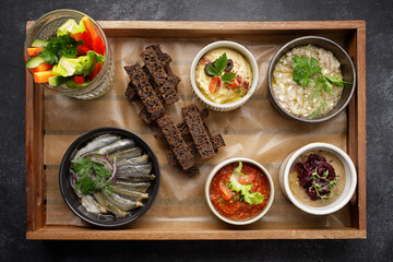 Various appetizers, snacks from vegetables on a wooden board