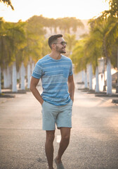 young man enjoying a summer walk at sunset