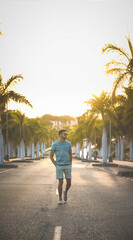 young man enjoying a summer walk at sunset