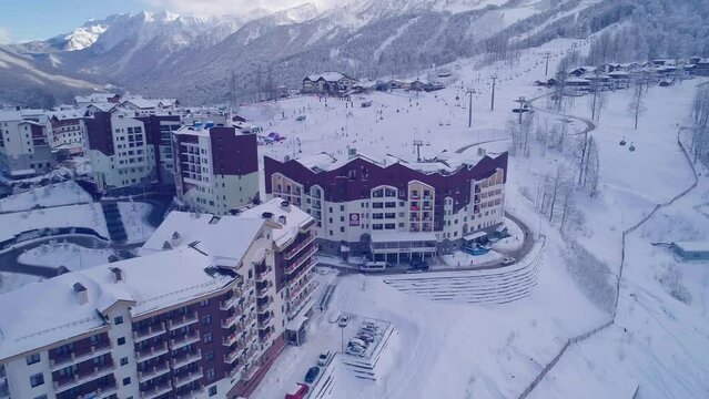 Hotels and ski lift on site of former Olympic village of Rosa Plateau at altitude of 1170 m from sea level. Krasnaya Polyana, Sochi, Russia