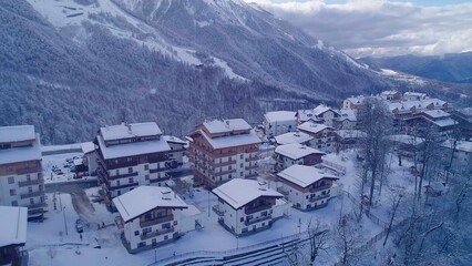 Winter aerial view of the Olympic mountain village Roza Plato. Beautiful winter landscape from drone.