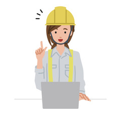 デスクで座ってPCを開いて何かひらめいた工事現場の女性
