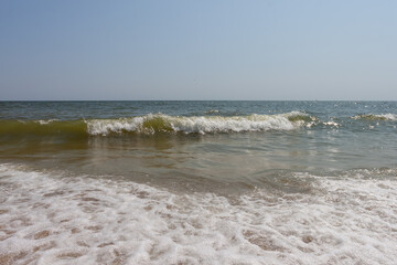 Sea view. Big and stormy waves of the Black Sea on a sunny day. Small depth of field