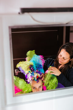 Sad girl in carnival getting dressed in costume