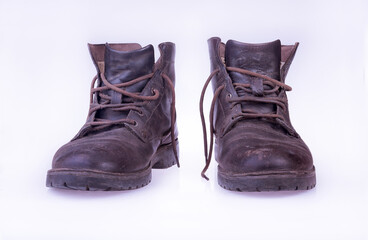 used leather brown boots isolated on white background